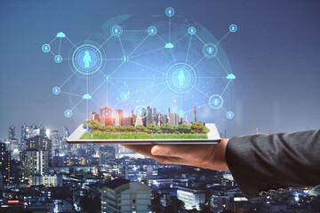 Poster - Close up of businessman hands holding tablet with abstract glowing connections globe on night city background.