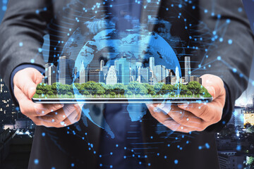 Poster - Close up of businessman hands holding tablet with abstract glowing connections globe on night city background.