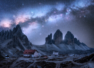 Wall Mural - milky way over the mountains at starry night in summer. landscape with alpine mountains, building, c