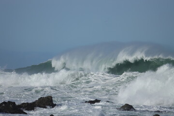  waves crashing on rocks