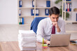 © Elnur - Young male employee and too much work in the office