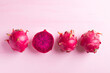 Ripe red dragon fruit or pitaya on pink background, Tropical fruit