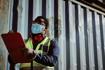 Young Black Container Inspector with face mask