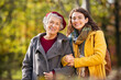 © Rido - Old woman in park with daughter looking at camera