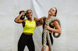 © Jacob Lund - Two sports women with kettlebell and battle rope