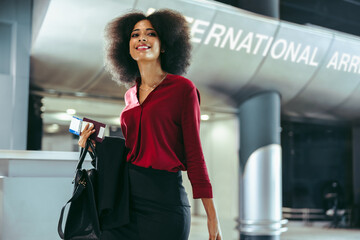 Wall Mural - Female business travelers on transit at airport terminal