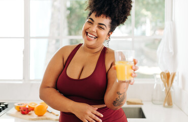 Healthy woman smiling with fresh fruit juice