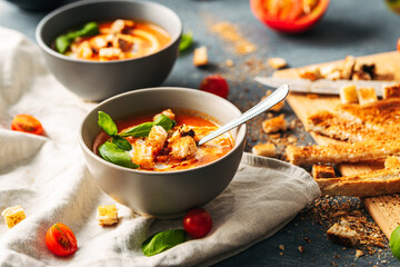 Wall Mural - Tomato soup. Tomato creme with basil and bread.  Bowl with italian tomato soup. 