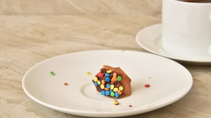 Canvas Print - Donut vanishing off a plate with a cup of coffee, stop motion animation
