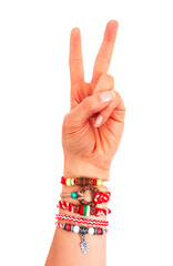 Bulgarian traditional spring decor bracelet martenitsa, female hand two fingers. Baba Marta holiday, peace gesture, isolated on white background.