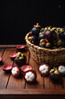 © artrachen - Mangosteen fruit on wooden background