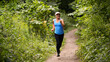 © Angelov - Pretty sporty woman jogging at park