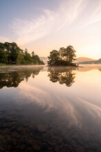 Beautiful Clouds At Sunrise On A Summer Morning At Derwentwater In The Lake District. Manesty Island.