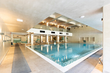 Indoor swimming pool in hotel wellness center