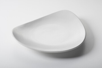 Semicircle shaped white ceramic plate