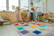 © lithiumphoto - Preschool students having fun time jumping and walking on massage mats