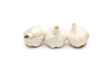 Wall Mural - Three organic fresh garlic on isolated white background