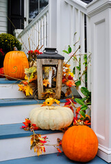 fall flowers and decor on the porch