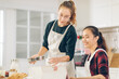 © iStocker - Woman making delicious cream for cupcakes