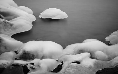 Wall Mural - ice covered rocks at the lake