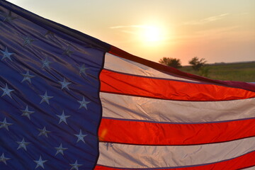 America Flag with a Sunset in the Background