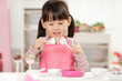 © M-image - young  girl pretend play food preparing at home
