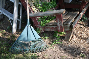 Wall Mural - Rake by a Garden Bench