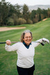 © Sergio Marcos/Stocksy - Golfer woman portrait