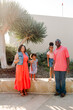 © Erin Brant/Stocksy - Happy Black family with two girls outdoors