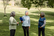 © McKinsey Jordan/Stocksy - Senior Women Hang Out After Yoga Session in the Park
