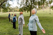© McKinsey Jordan/Stocksy - Row of Seniors Hold Tree Pose During Yoga