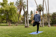 © McKinsey Jordan/Stocksy - Senior Man Stretches Alone in the Park