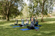 © McKinsey Jordan/Stocksy - Group of Elders Stretch While Meditating in the Park