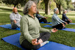 © McKinsey Jordan/Stocksy - Seniors Enjoy a Moment of Meditation in the Park