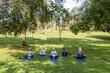 © McKinsey Jordan/Stocksy - Group of Seniors Practice Meditation in the Park