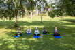 © McKinsey Jordan/Stocksy - Seniors Meditate During a Yoga Session in the Park
