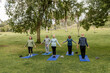 © McKinsey Jordan/Stocksy - Seniors Hold Mountain Pose While Practicing Yoga
