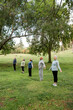 © McKinsey Jordan/Stocksy - Diverse Group of Seniors Practice Yoga in the Park