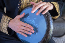 Female Drummer Wearing A Traditional Arabic Clothes Playing Darbuka Percussion Instrument.