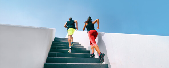 Wall Mural - Couple fitness workout two athletes running up stairs sprinting uphill working out dynamic exercise panoramic runners training hiit workout banner. 