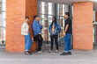 © Kike Arnaiz/Stocksy - Group of diverse friends talking near building in city