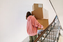 Woman Carrying Boxes