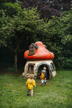 Siblings In A Garden With Gnome House