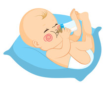 Cute Little Baby Drinking Milk On Bottle Lying On Big Blue Pillow
