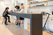 © Hernandez & Sorokina/Stocksy - People At Modern Co-working Kitchen