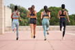 © Guille Faingold/Stocksy - Running women from behind.