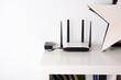 © Elena Kharichkina/Stocksy - Wi-Fi router in the interior of the house