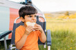 © VICTOR TORRES/Stocksy - Child eating delicious sandwich in armchair on lawn