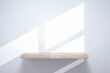 © YiChao Ma/Stocksy - empty shelf on wood table showcase and wall background