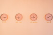 © Javier Díez/Stocksy - Clocks with different time hanging on wall